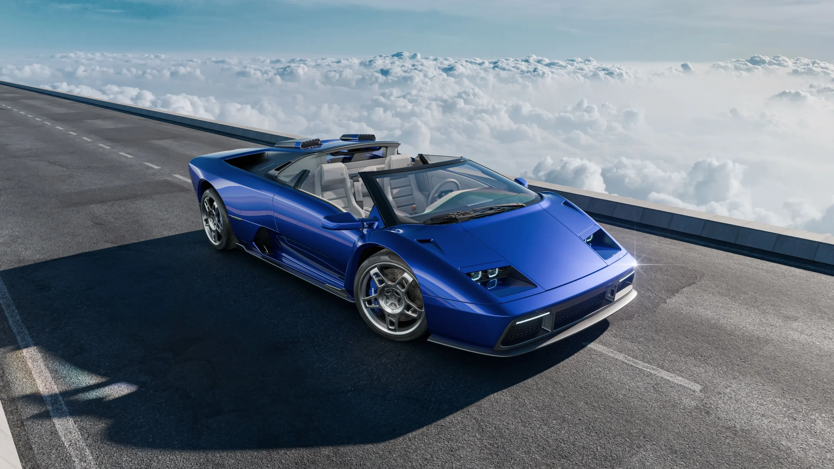 Blue convertible sports car parked on an elevated road above a sea of clouds under a clear blue sky.