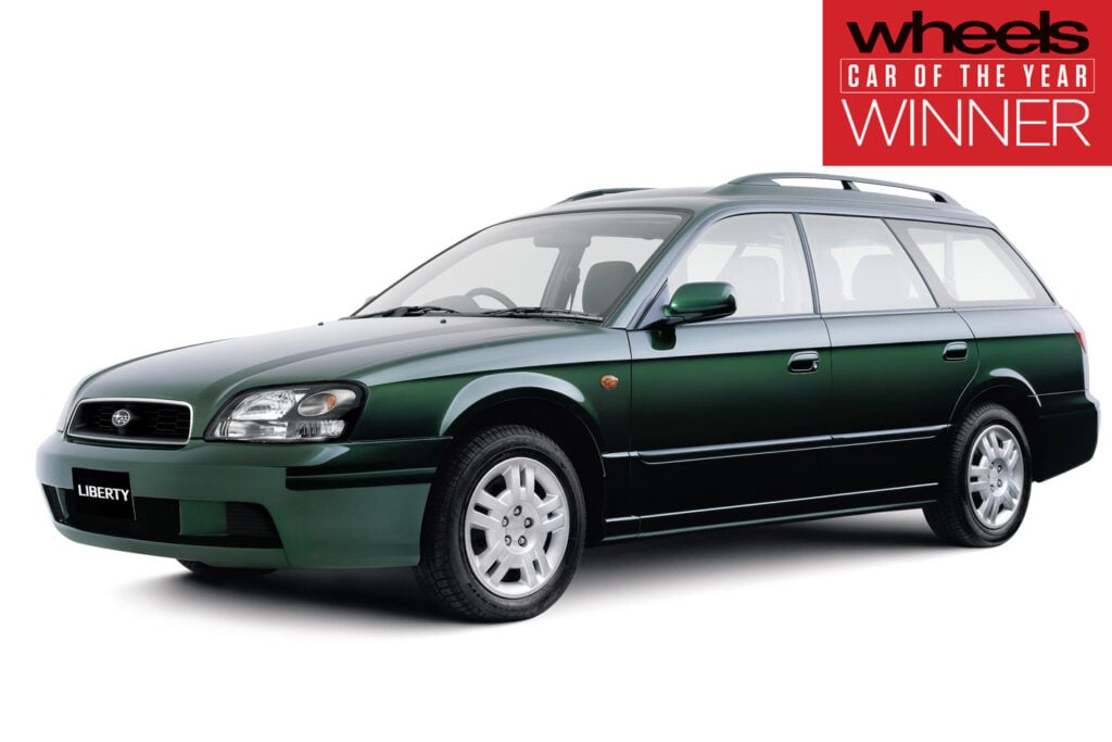 Green station wagon (Liberty model) shown from a three-quarter front view, with a red 'Wheels Car of the Year Winner' badge in the top-right corner.