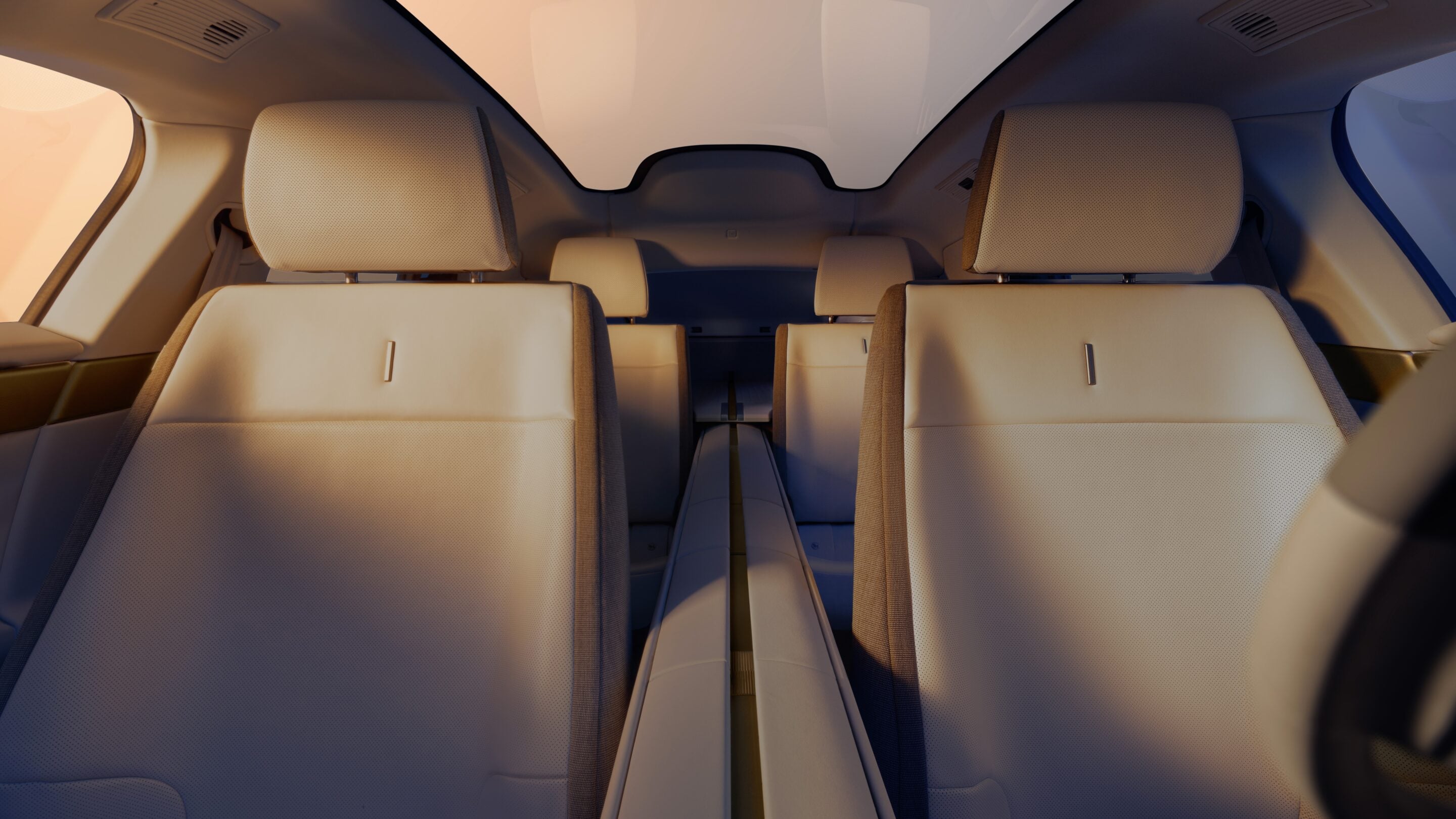 Interior view of a passenger airplane cabin with beige seats, a narrow central aisle, and overhead panels visible along the ceiling.