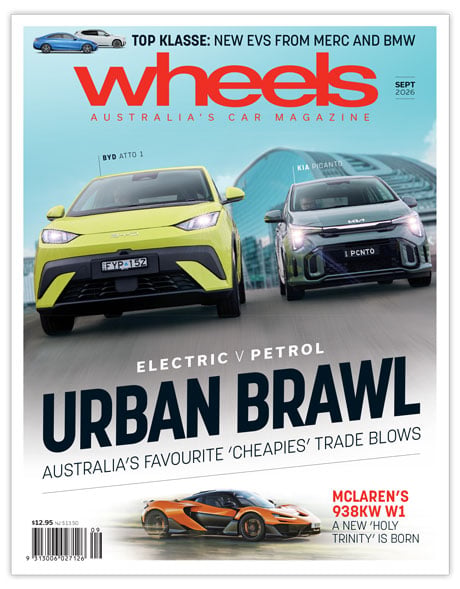 Wheels magazine cover with two cars racing toward the viewer and bold title 'Urban Brawl' across the lower half.