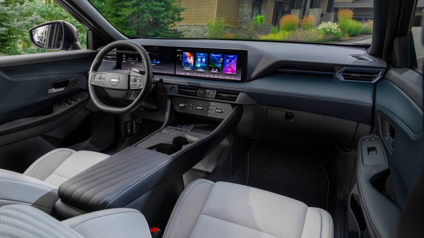 Modern car interior with a wide digital dashboard and center touchscreen, steering wheel, and light gray perforated seats