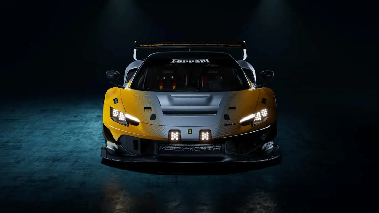 Front view of a yellow-and-gray Ferrari race car with bright headlights in a dark studio setting, large rear wing visible.