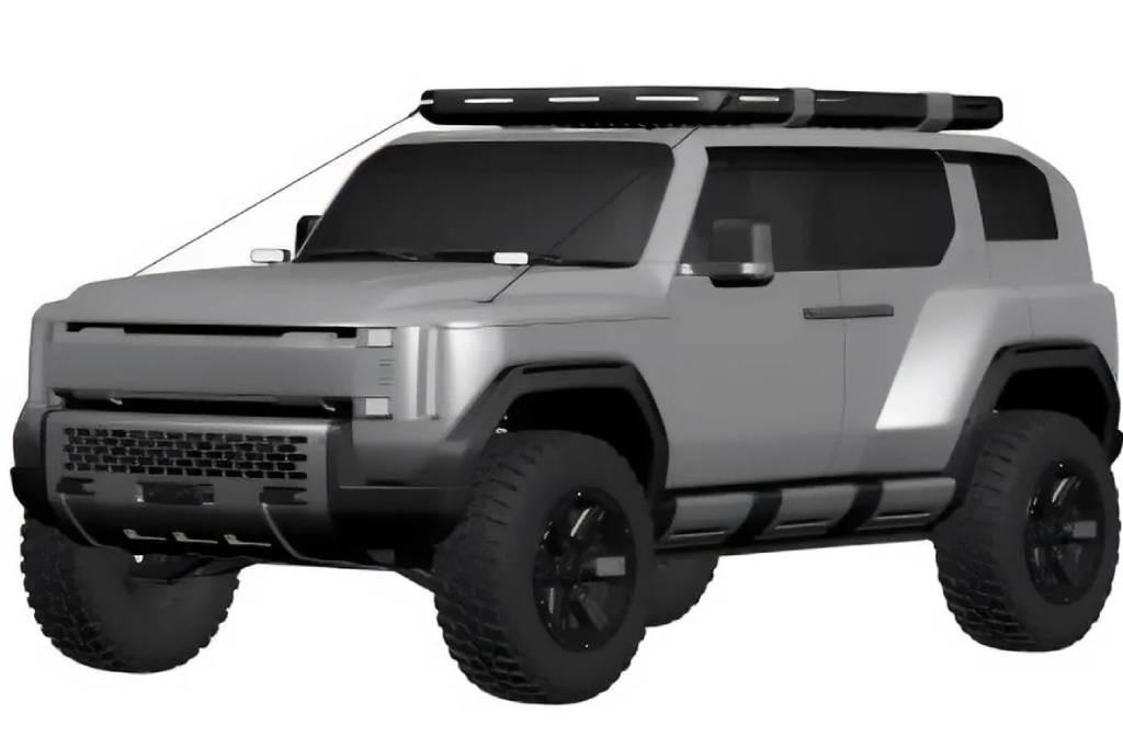 Silver-gray off-road SUV with oversized tires and a roof rack, viewed from the front-left corner.