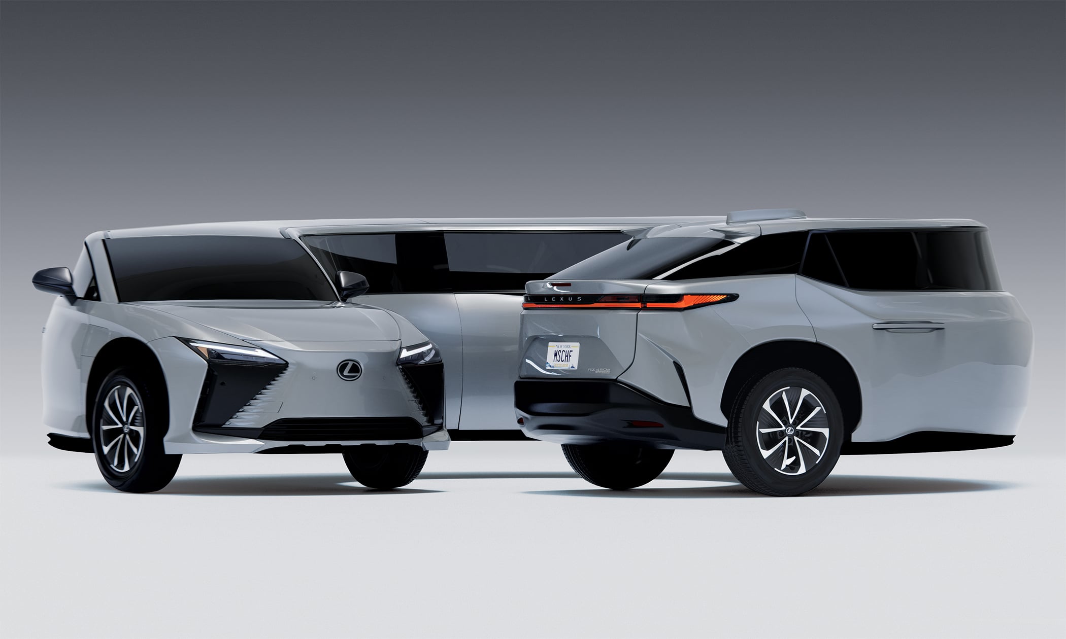 Two white Lexus SUVs shown side by side in a studio with a gray gradient background.