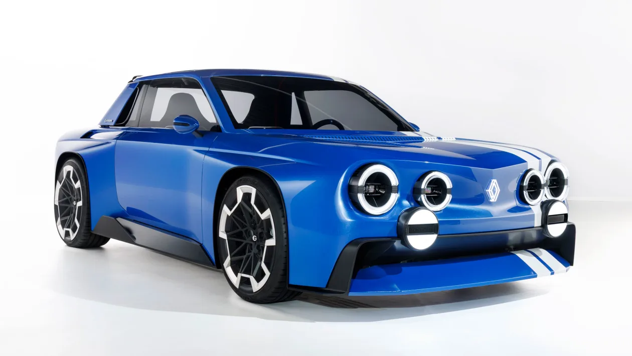 Blue concept sports car with four round headlights and white racing stripes in a white studio setting, three-quarter front view
