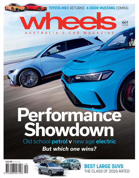 Wheels magazine cover with two fast cars in blue hues for a 'Performance Showdown' and headline 'Old school petrol vs new age electric'—But which one wins?