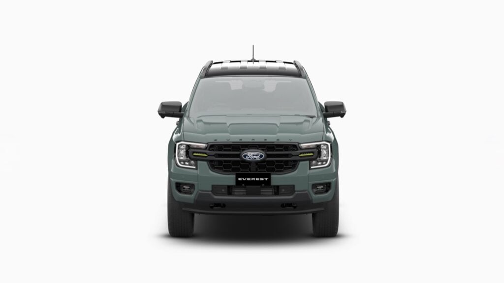 Front view of a green Ford Everest SUV showing its grille, headlights, and bold bumper.