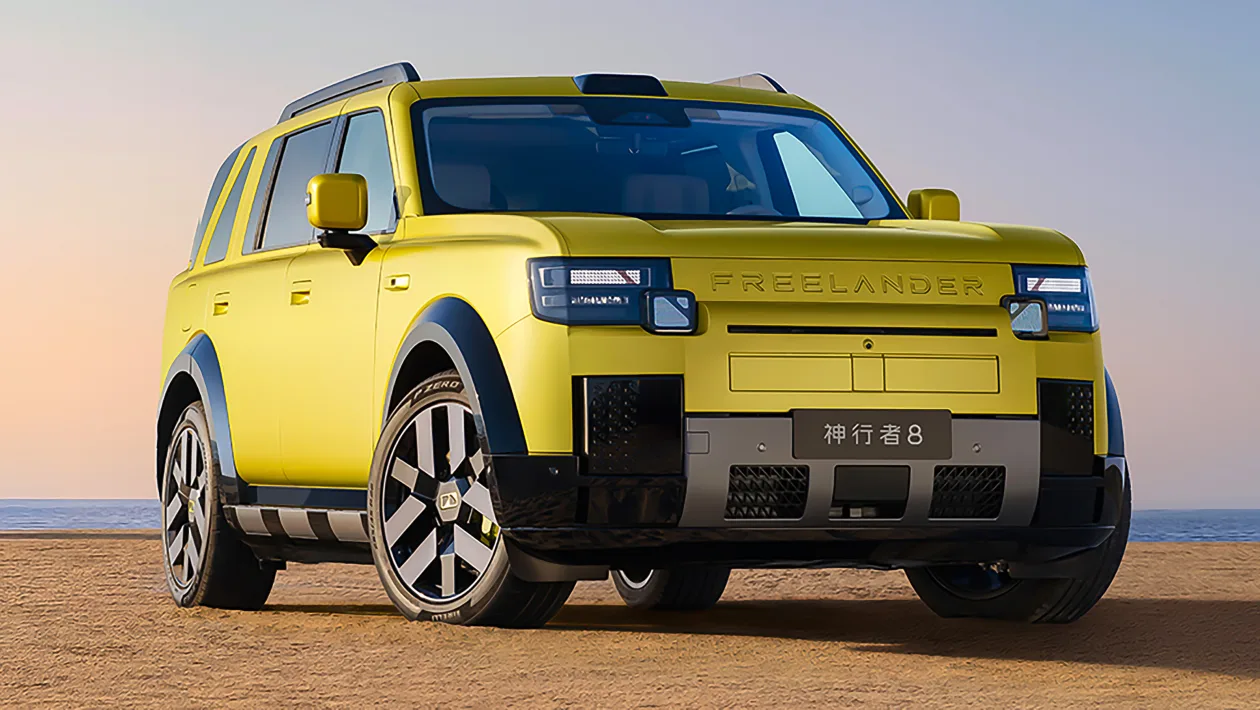Bright yellow SUV parked on a sandy beach with the ocean on the horizon at sunset/soft light behind it while front and side views are visible in the image.